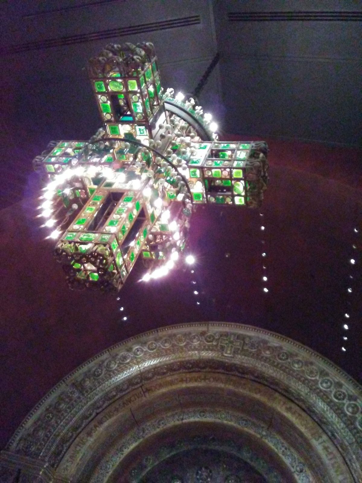 Tiffany glass chapel chandelier glowing in the Morse Museum