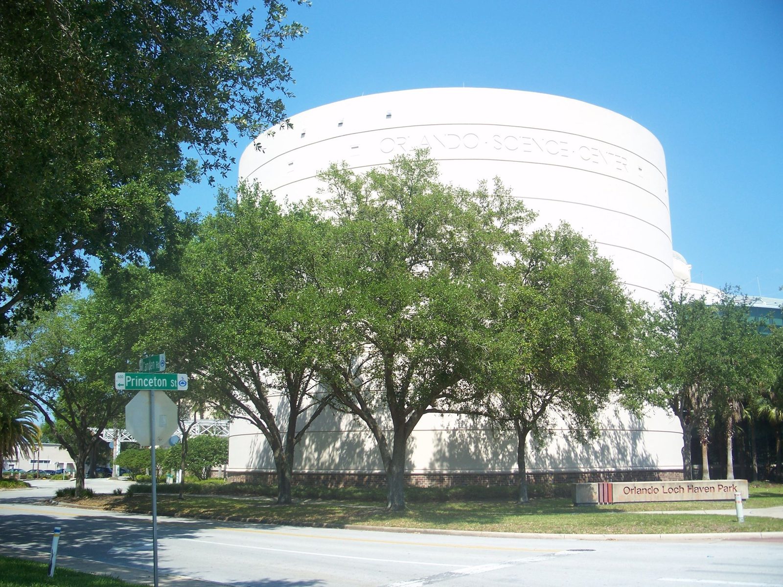 Orlando Science Center building framed by oaks
